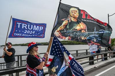 Supporters of former President Donald Trump gather near his residence at Mar-A-Lago in Palm Beach, Florida, on Aug. 9, 2022.